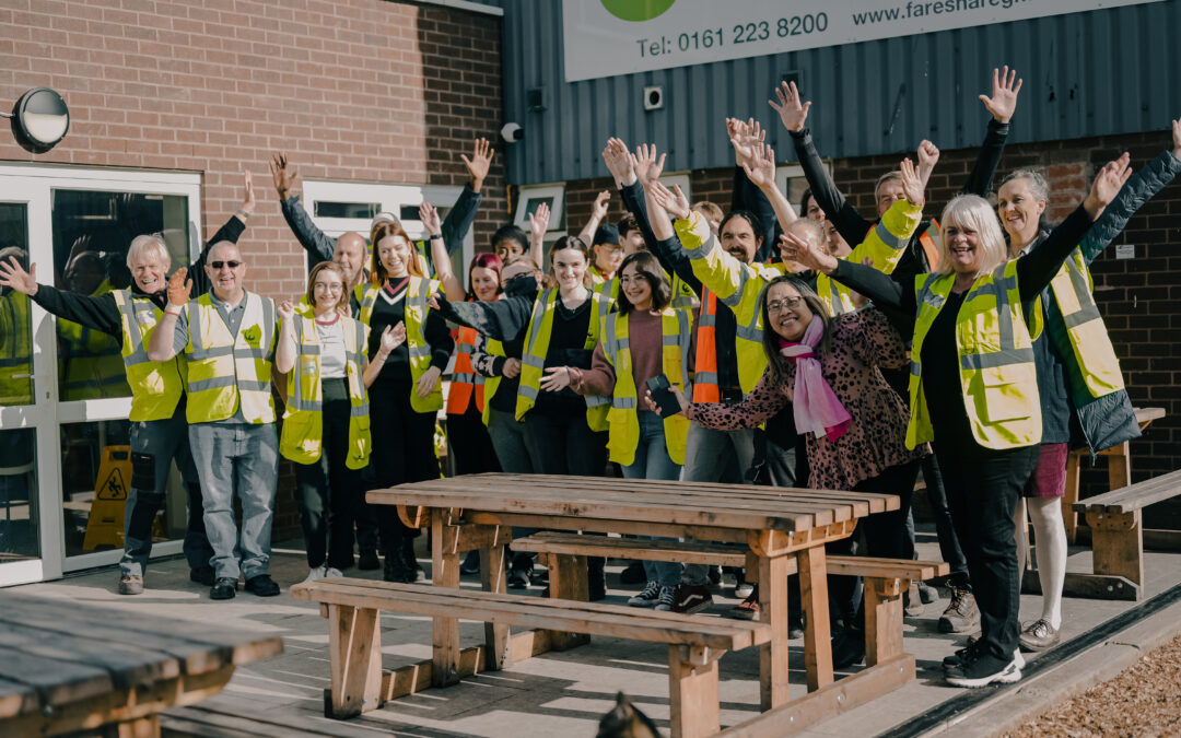 Staff team standing outside smiling